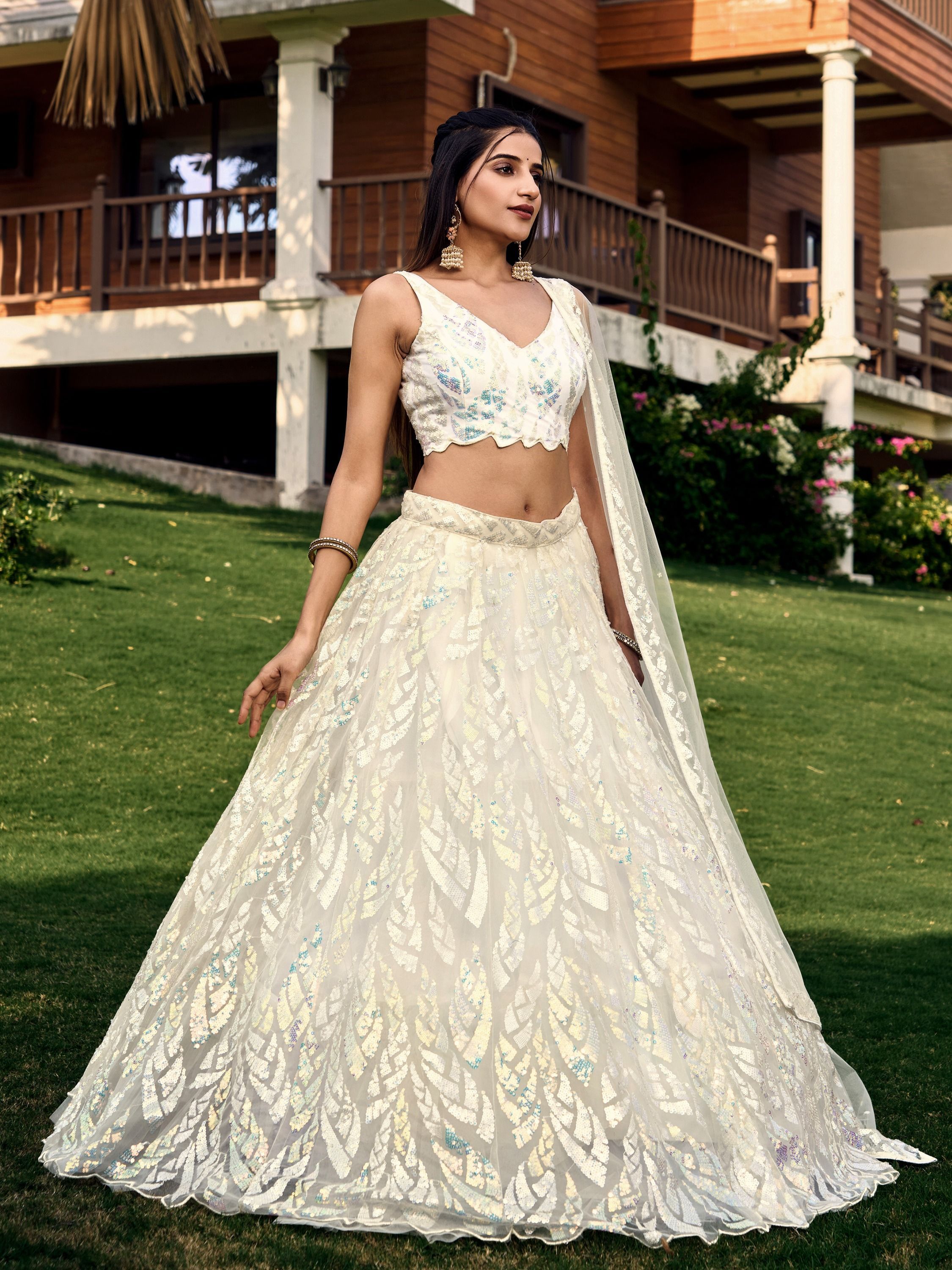 Off White soft net lehenga choli with heavy multi sequins embroidery and lace border dupatta perfect for weddings receptions and glam parties